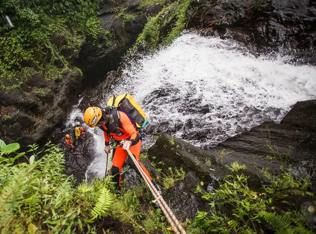 Rappelling down a waterfall in North Bali canyoning