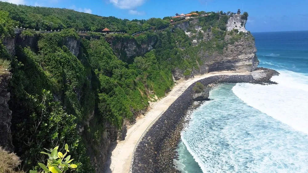 Uluwatu Temple perched on cliff above Indian Ocean Bali